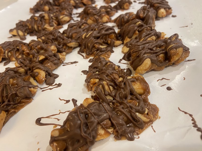 Chocolate and caramel covered peanut clusters